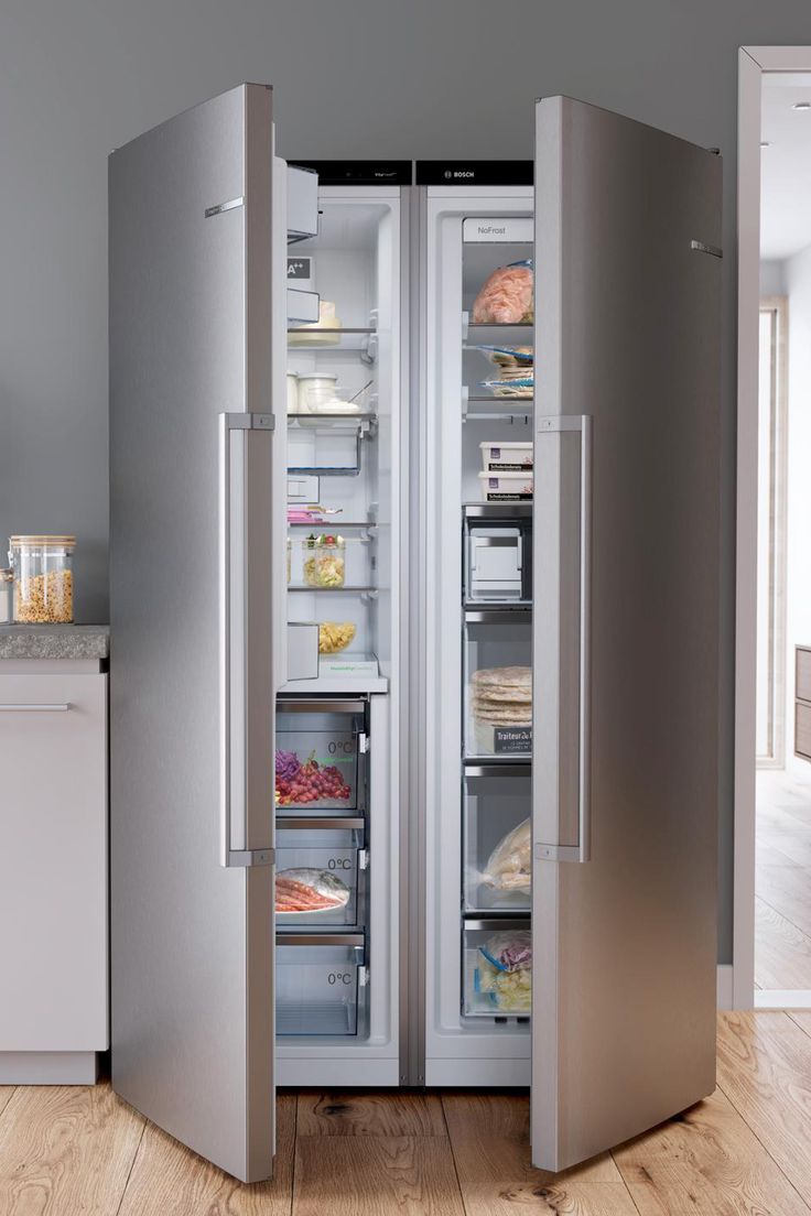 Open stainless-steel side-by-side fridge freezer in a modern kitchen